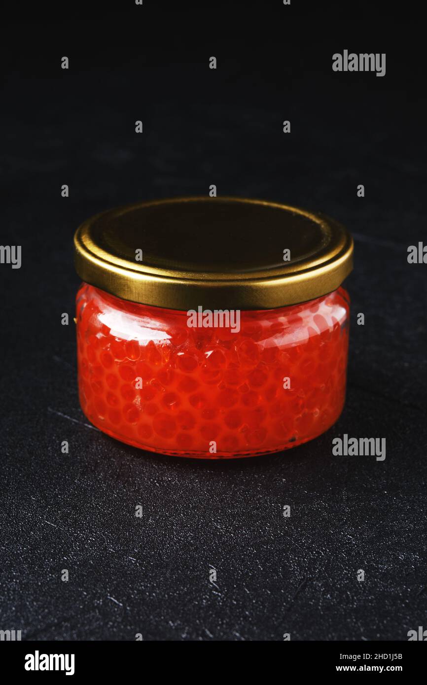 Jar with pink salmon red caviar Stock Photo