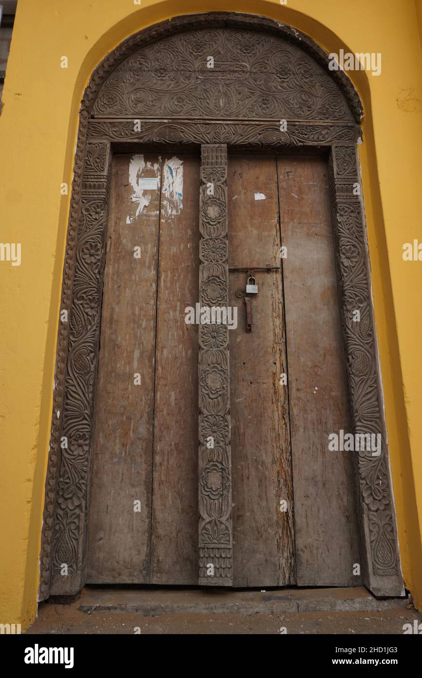 Wooden door with carved ornaments in Mombasa, Kenya Stock Photo