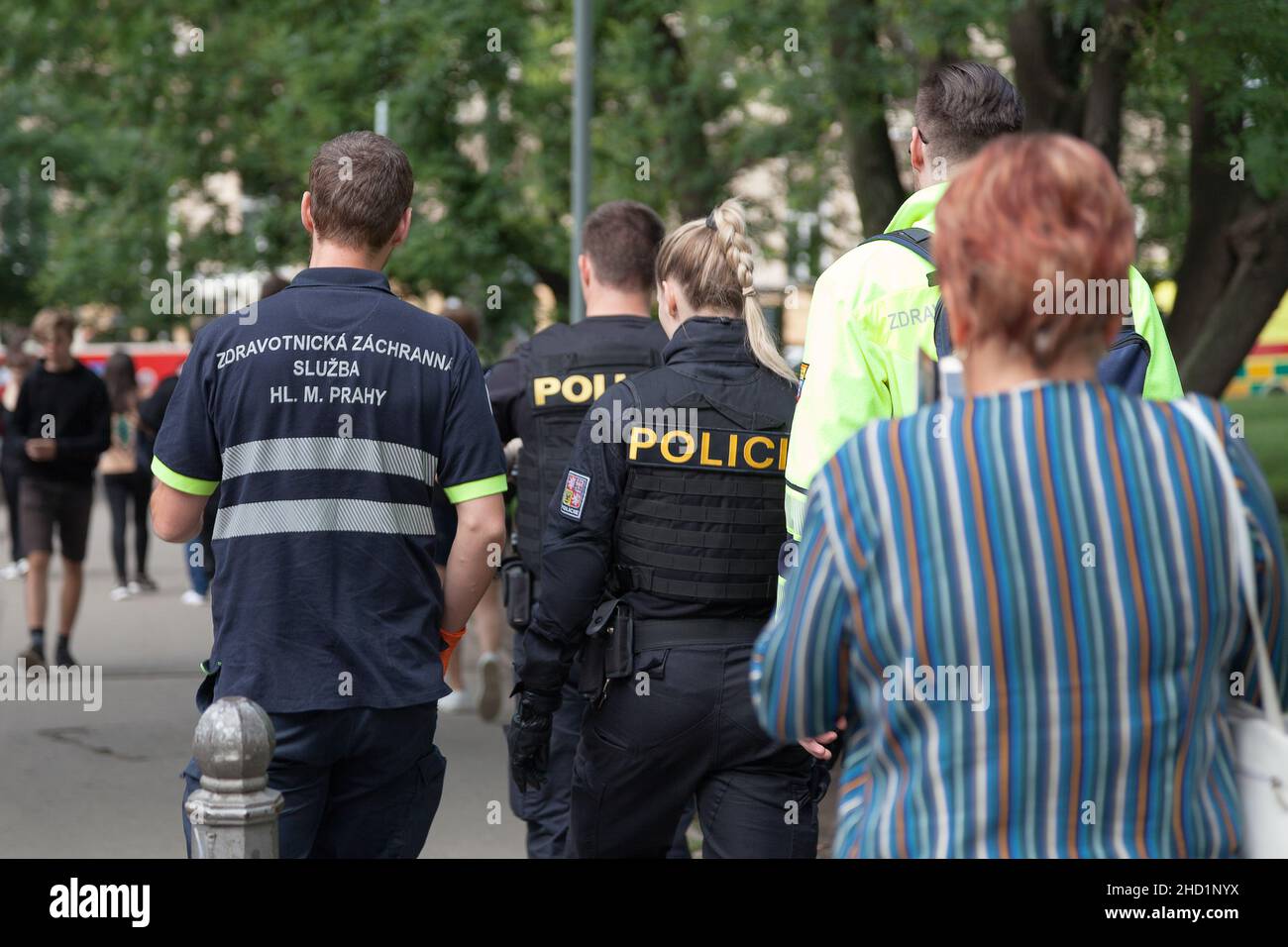 Prague, Czech Republic - June 14 2018: Two paramedics of the Medical Emergency Service of the Capital City of Prague and two policemen Stock Photo