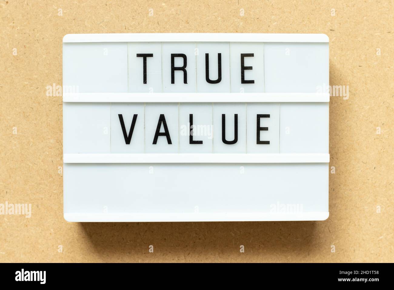 Lightbox with word true value on wood background Stock Photo