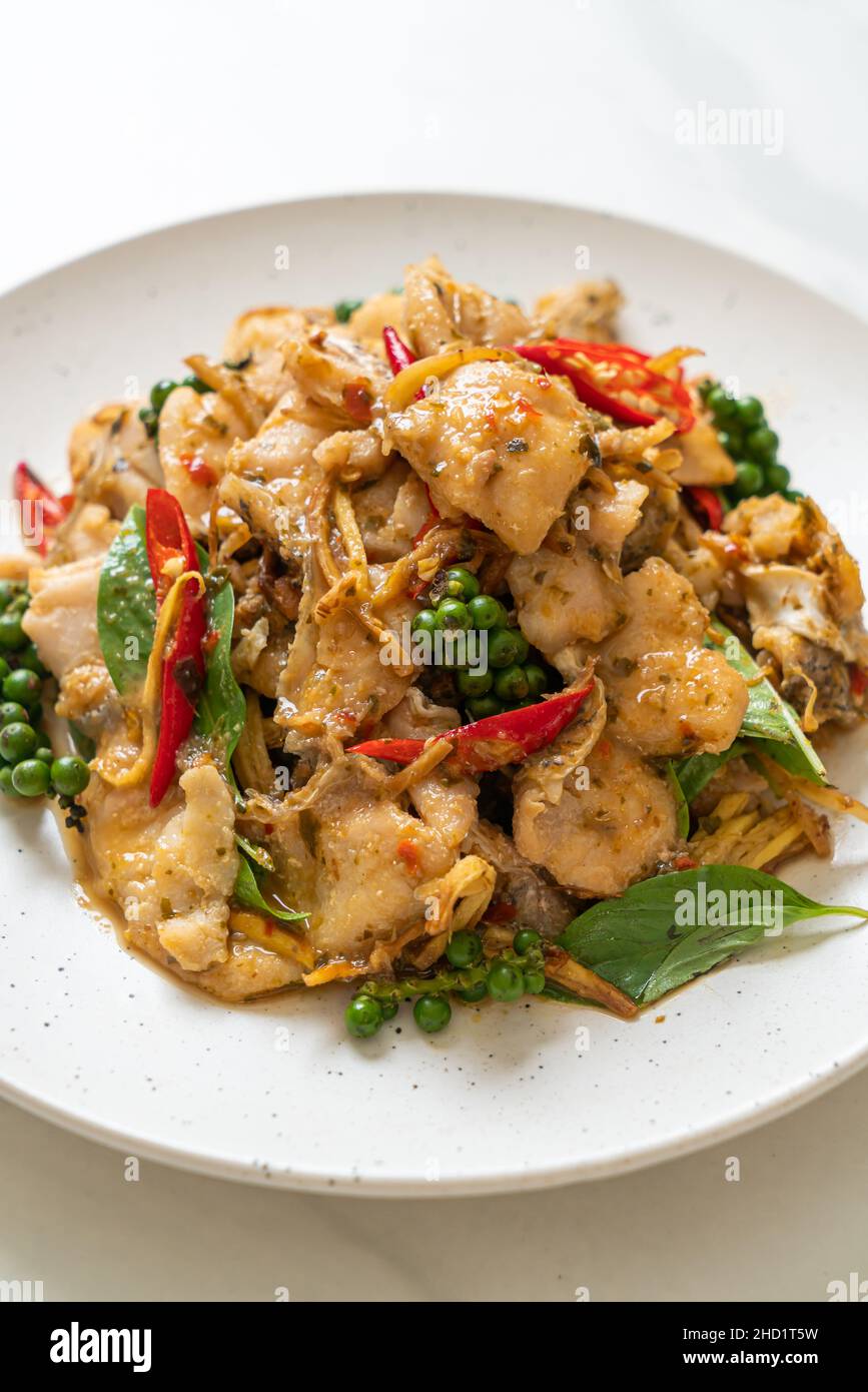 stir fried holy basil with fish and herb Asian food style Stock Photo