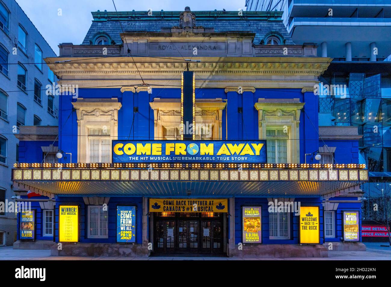 Illuminated facade of the Royal Alexandra Theatre by Mirvish Productions. The famous place is exhibiting the play 'Come From Away'.Jan. 2, 2022 Stock Photo