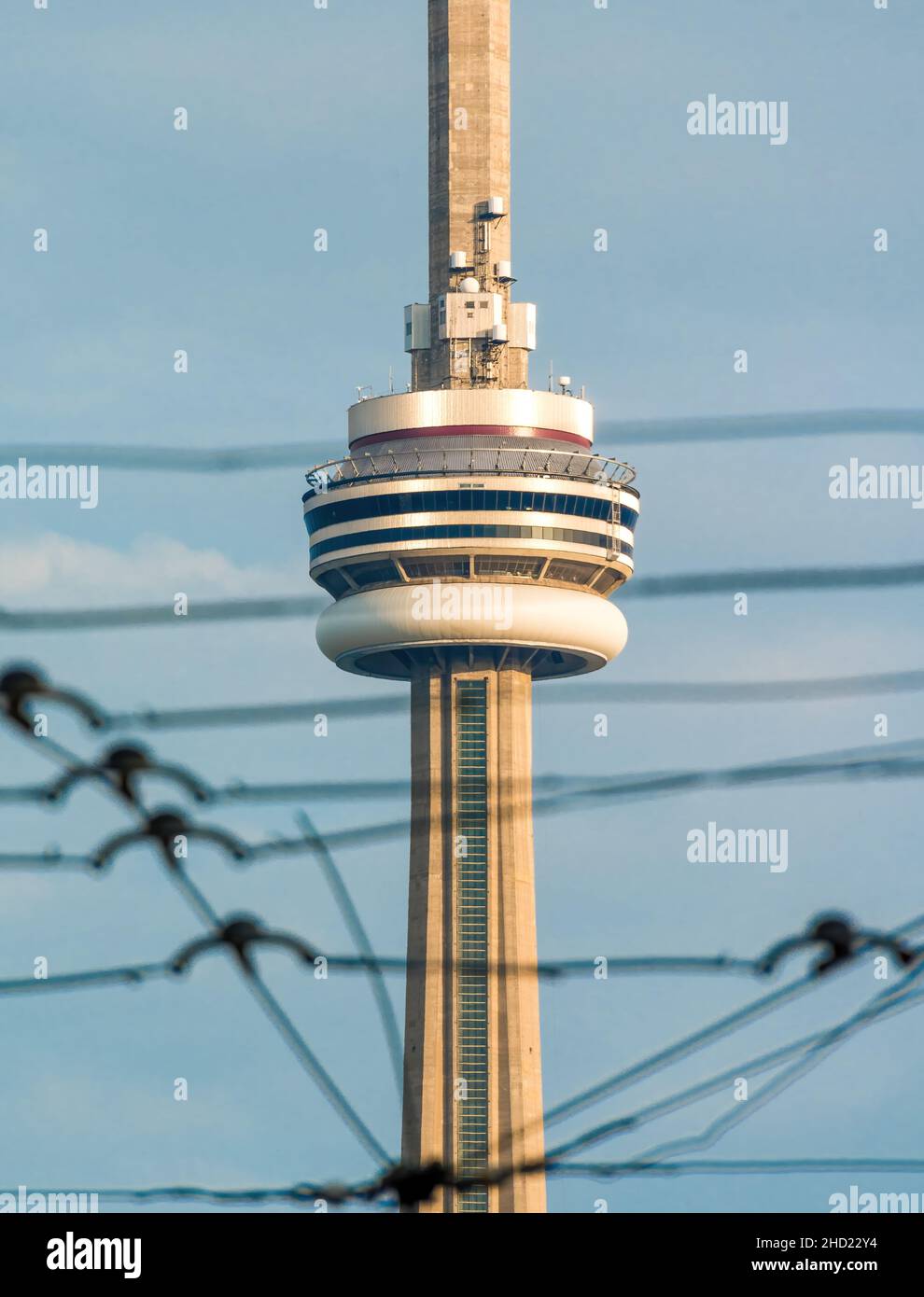 The CN Tower framed in the electric cables used by TTC streetcars. Jan. 2, 2022 Stock Photo