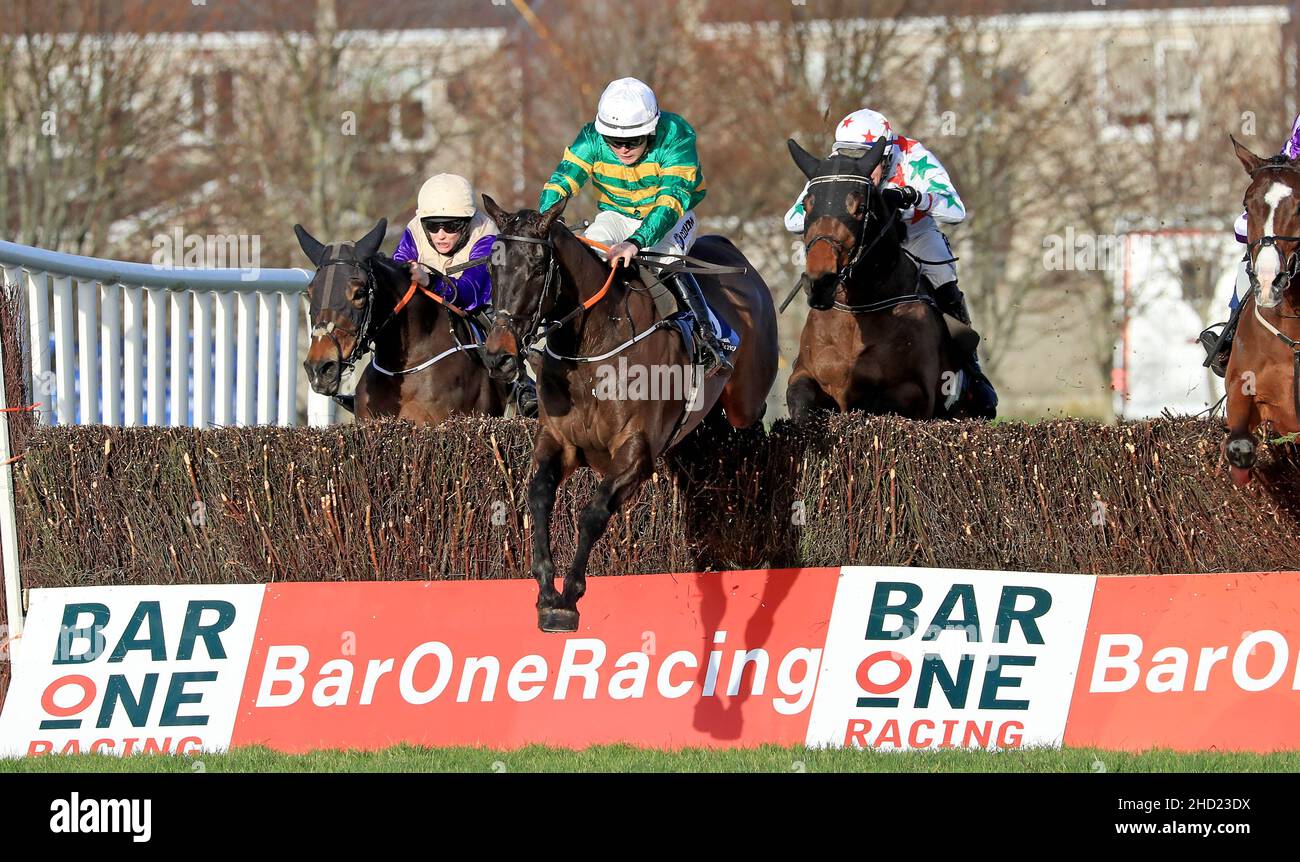 Fighting Fit ridden by Luke Dempsey clear the last fence on their way to winning the Eastcoast Seafood & Gouldings Hardware Handicap Chase at Naas racecourse. Picture date: Sunday January 2, 2022. Stock Photo