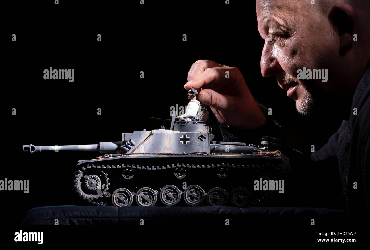 Roger Foster with a 1/16 scale replica of 1942 German StuG III tank, during The Manchester Military History Society's tank meet in Hyde, Manchester. Picture date: Sunday January 2, 2022. Stock Photo