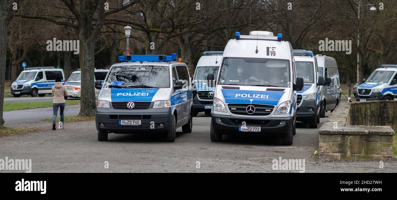 Hanover, Germany. 02nd Jan, 2022. Police vehicles stand at the Löwenbastion at the Maschsee. The police of Hanover has summarily assessed a so-called 'Corona walk' - an unregistered event with several people as a protest against the state Corona measures - as an unregistered demonstration. In Hanover, several such gatherings had already been broken up over the weekend - partly too many people were walking together, partly the participants were not wearing masks. Credit: Julian Stratenschulte/dpa/Alamy Live News Stock Photo