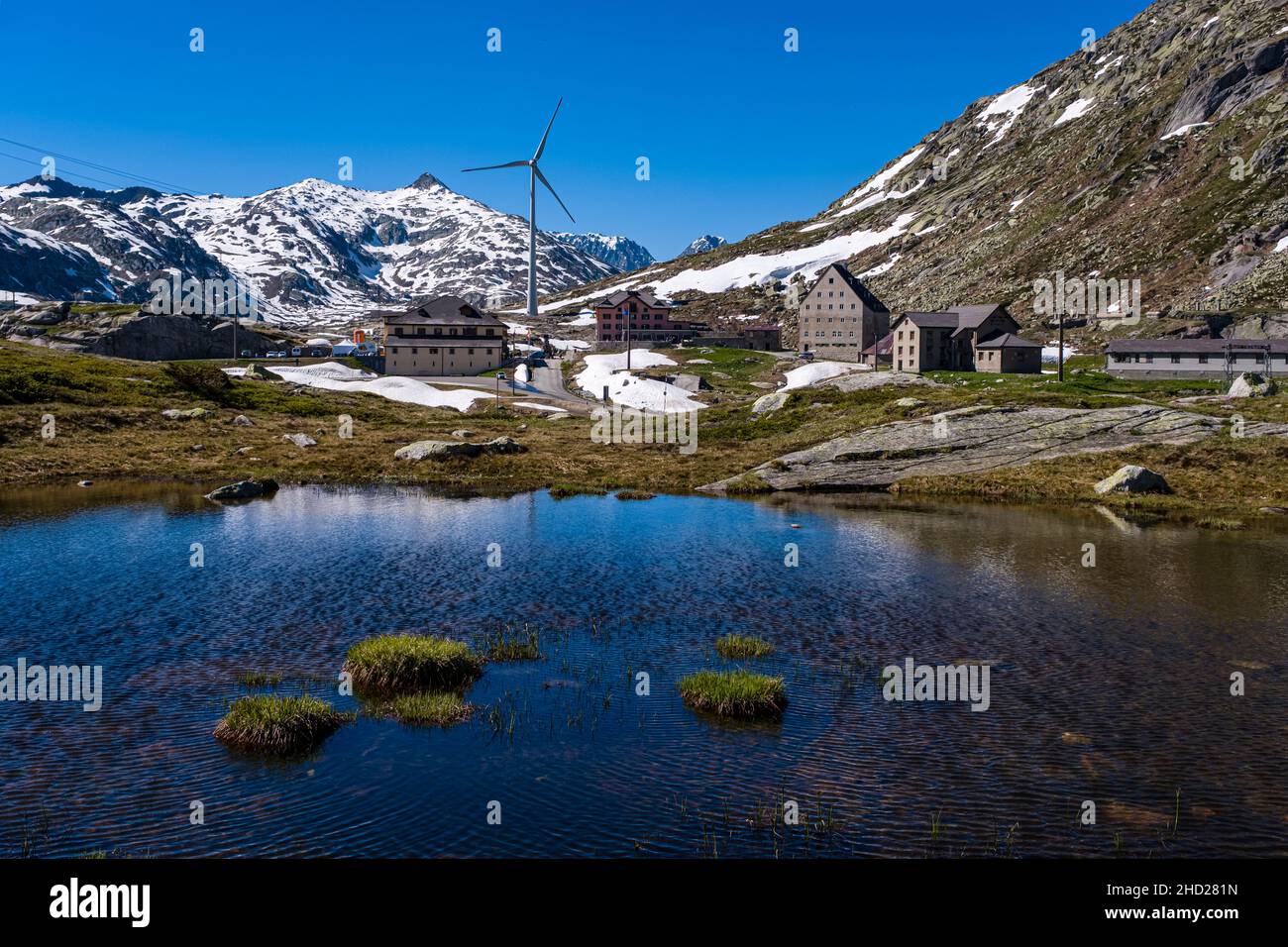 Buildings and a wind turbine on top of Gotthard Pass at 2106 m. Stock Photo