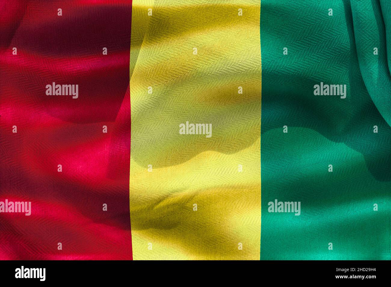 A 3D illustration of the realistic waving fabric flag of Guinea - background, wallpaper Stock Photo