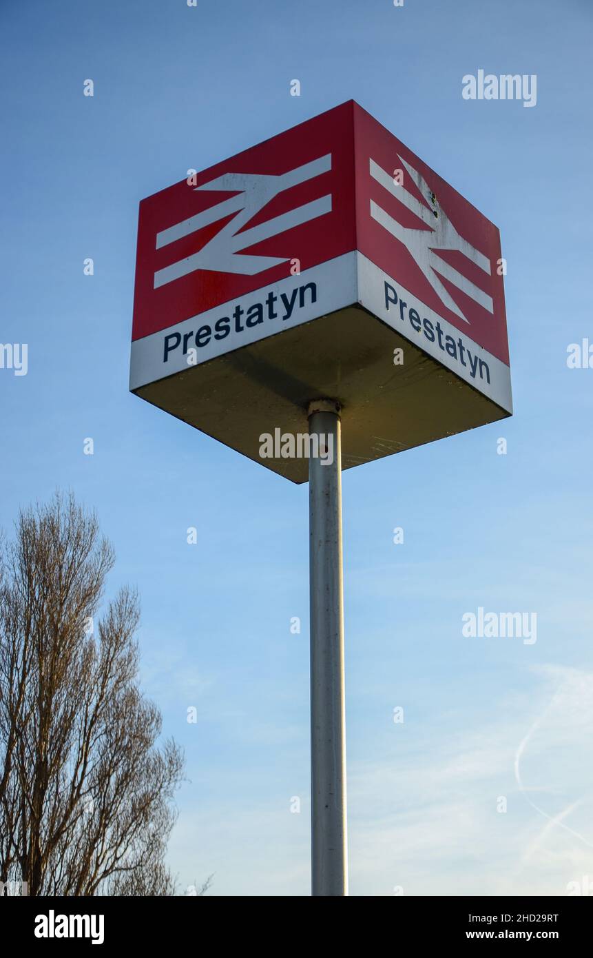 Prestatyn, UK:Dec 14, 2021: The British Rail double arrow logo designed by Gerry Barney features on a prominent, high mounted sign beside Prestatyn ra Stock Photo