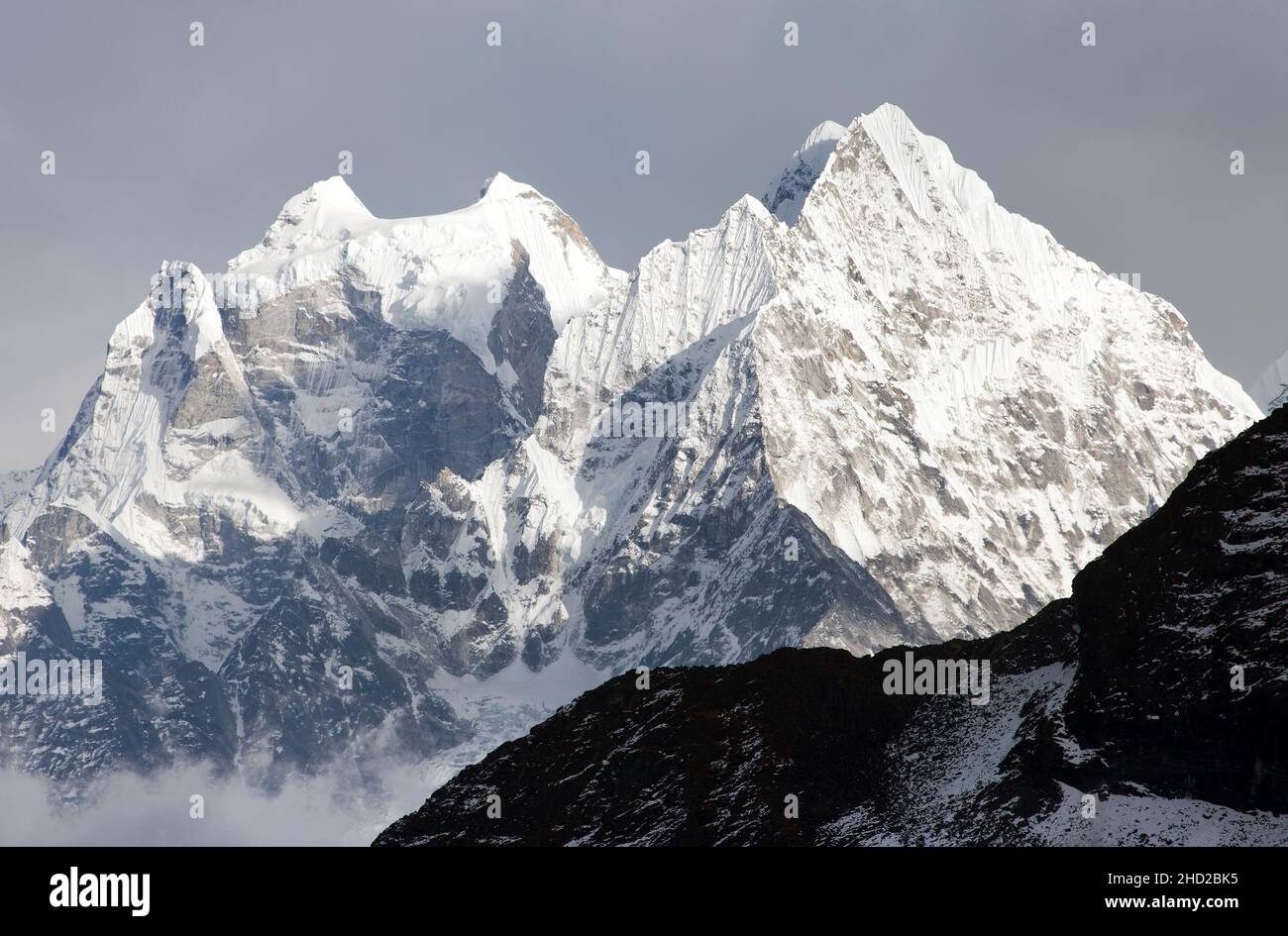 Kangtega and Thamserku - beautiful mounts above the Namche Bazar on the way to Everest Base Camp - Nepal Stock Photo