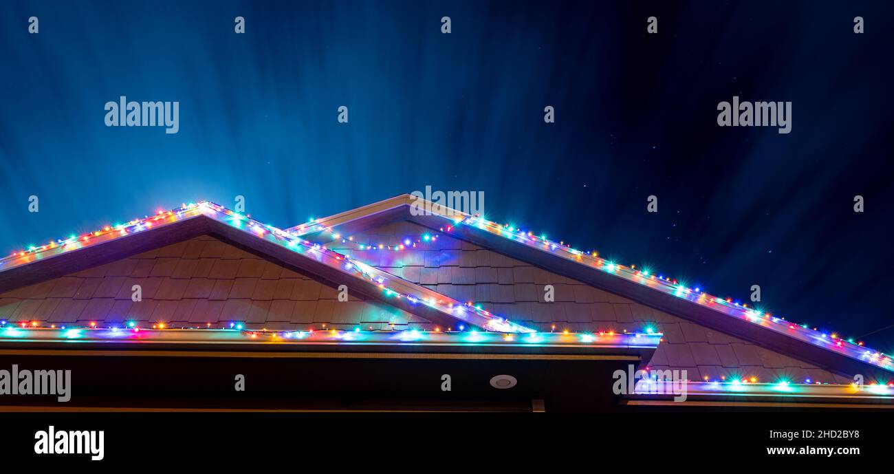 Sagging Christmas lights outdoors on a house that have come loose from