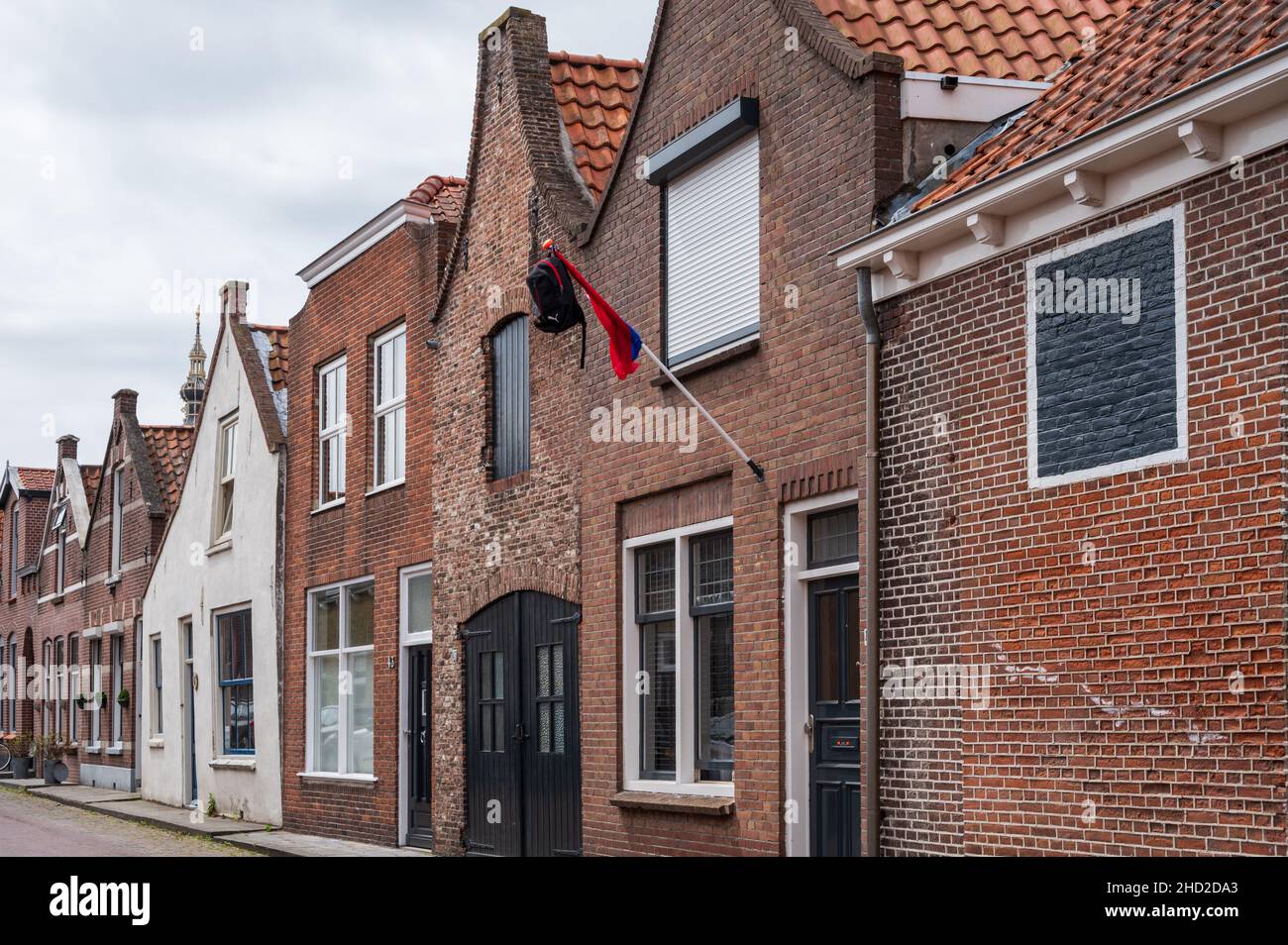 Walking in old Dutch town Zierikzee with old small houses and streets