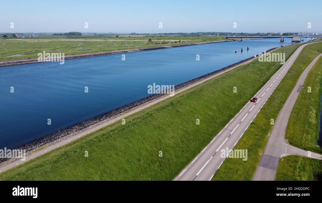 Aerial view on green polders, meadows and water transportion channel in South Beveland, Zeeland, Netherlands in summer Stock Photo