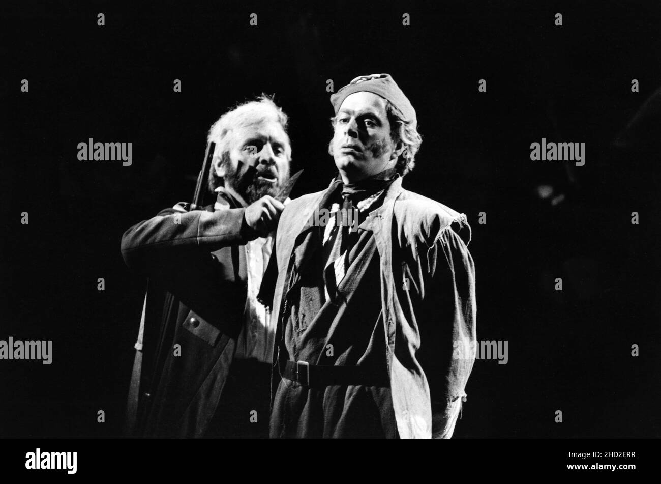 original London cast - l-r: Colm Wilkinson (Jean Valjean), Roger Allam (Javert) in LES MISERABLES at the Barbican Theatre, London EC2  08/10/1985   music: Claude-Michel Schonberg  text: Herbert Kretzmer  original text by Alain Boubil & Jean-Marc Natel   additional material: James Fenton  based on the novel by Victor Hugo  adapted & directed by Trevor Nunn & John Caird  set design: John Napier  costumes: Andreane Neofitou  lighting: David Hersey  a Royal Shakespeare Company (RSC) & Cameron Mackintosh co-production   transferred to the Palace Theatre, London W1 04/12/1985-2004   transferred to t Stock Photo