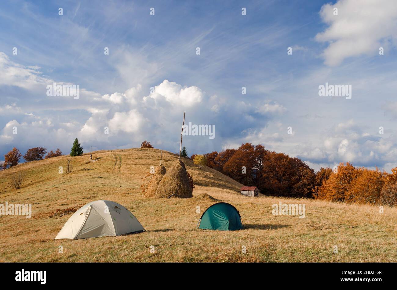 Camping with two tourist tents in the mountains. Autumn landscape Stock Photo