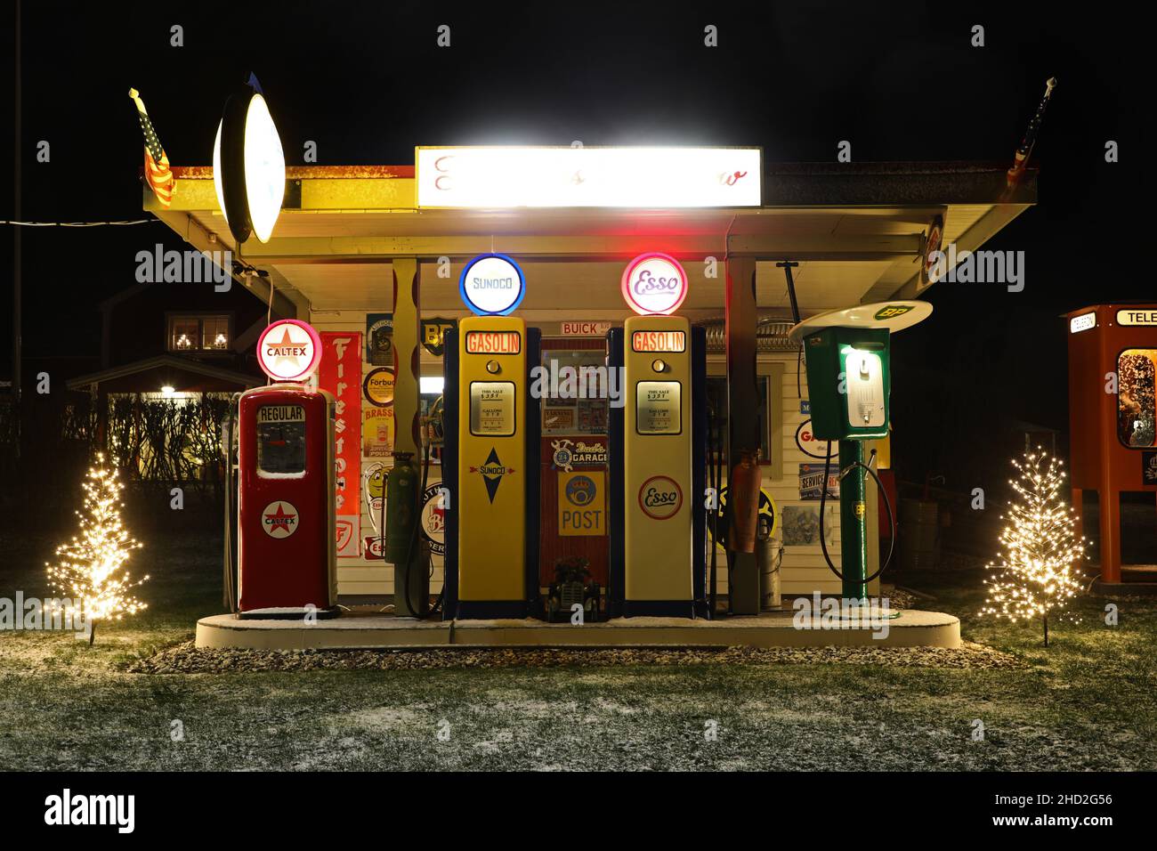 An old recreated gas station. Sign about "Free gas tomorrow Stock Photo Alamy
