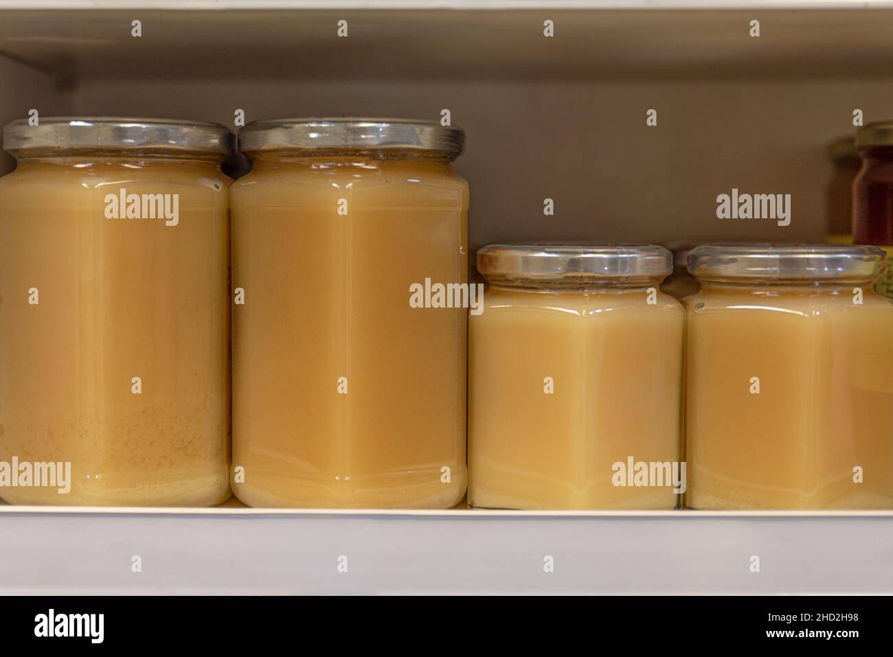 Set of glass bottles with honey, jam, marmalade, jams, preserves