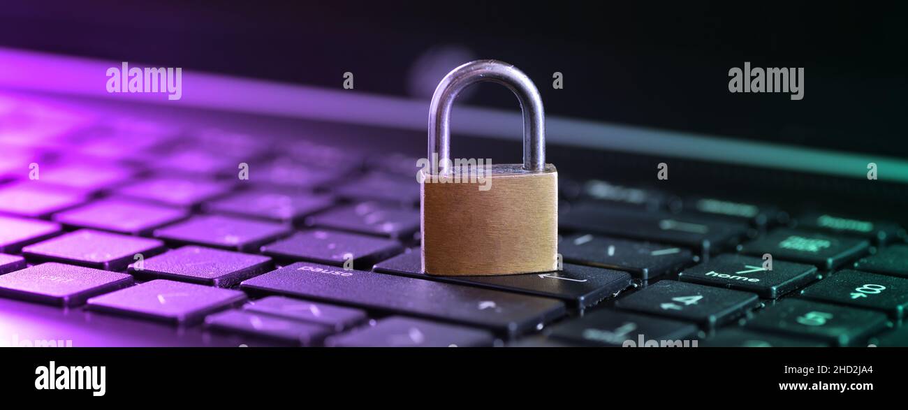 Cybersecurity concept, padlock on laptop computer keyboard. Stock Photo