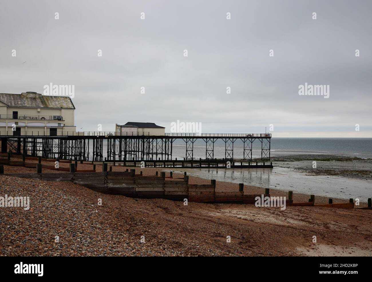 Seadefences and pier of Bognor Regis at low tide. Stock Photo