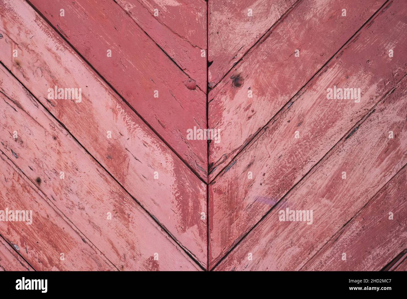 Red and pink ribbons on rustic brown wooden background for texture and  design Stock Photo