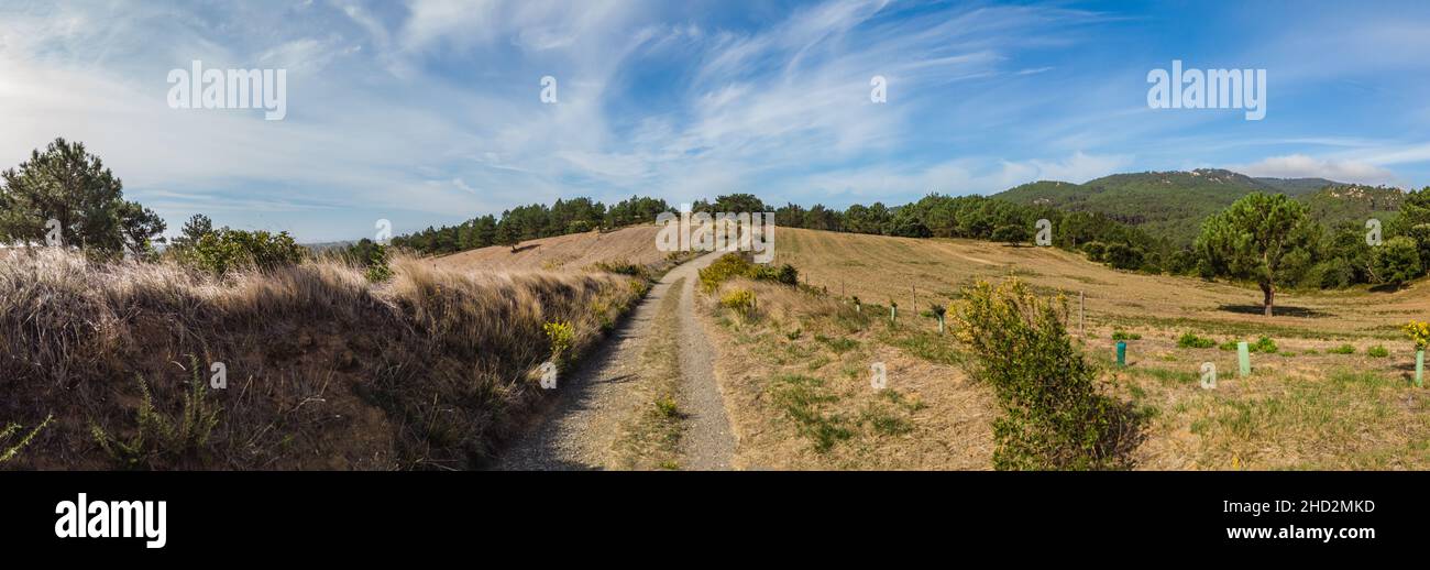 Countryside landscape Panorama with a path and mountain in background Stock Photo