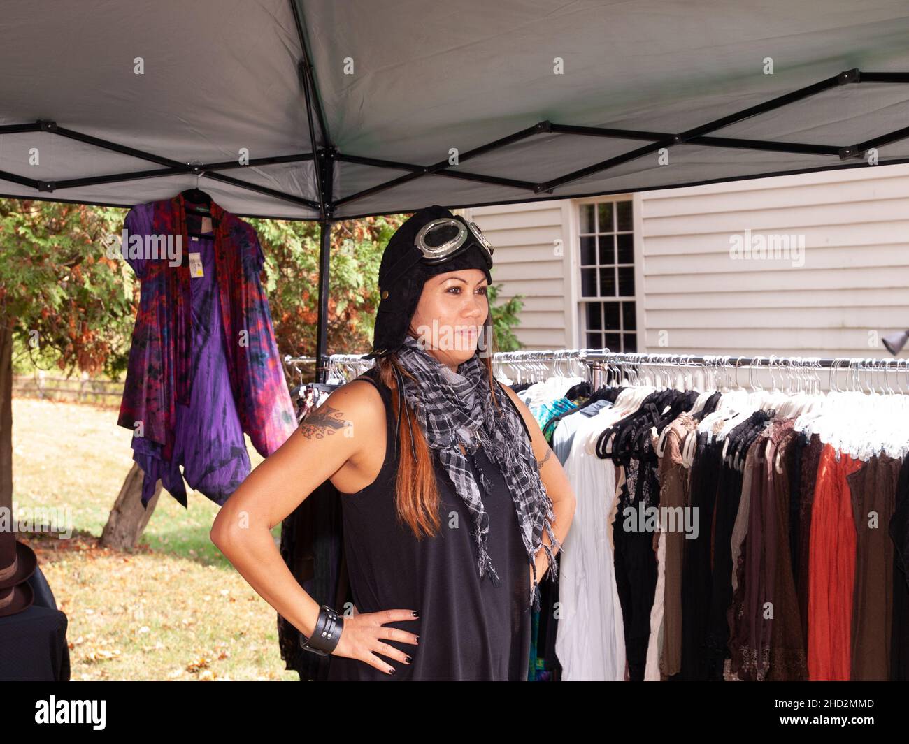 Steampunk Fashion - Woman vendor of Steampunk clothing dressed in aviator costume Stock Photo