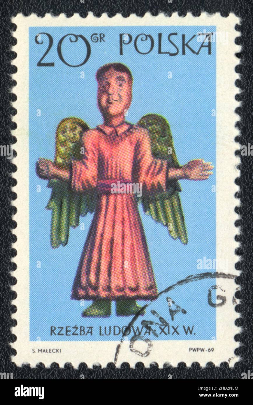 A stamp printed in Poland shows Folk sculpture XIX, Angel, Poland 1969 Stock Photo