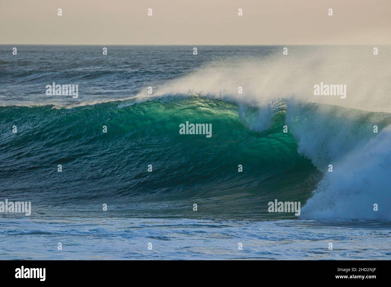 Perfect wave breaking in a beach. Surf spot Stock Photo