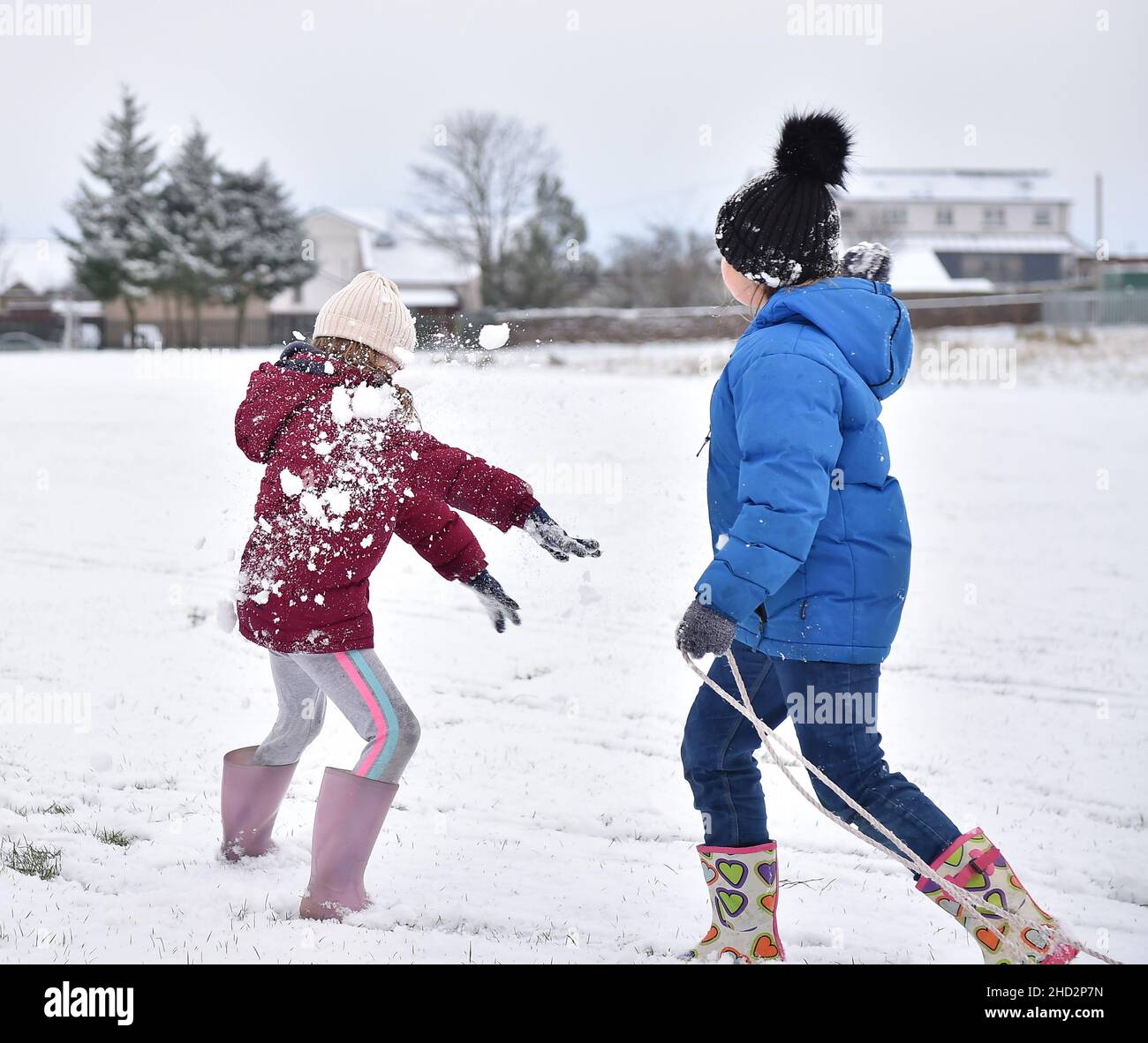 Pictured: Sisters Kerry Anne (7) and Jessica McBeth (9) from Armadale have some fun in the snow.  The first falls of snow in central Scotland meant fun in the snow for kids in Armadale, West Lothian.  (c) Dave Johnston Stock Photo