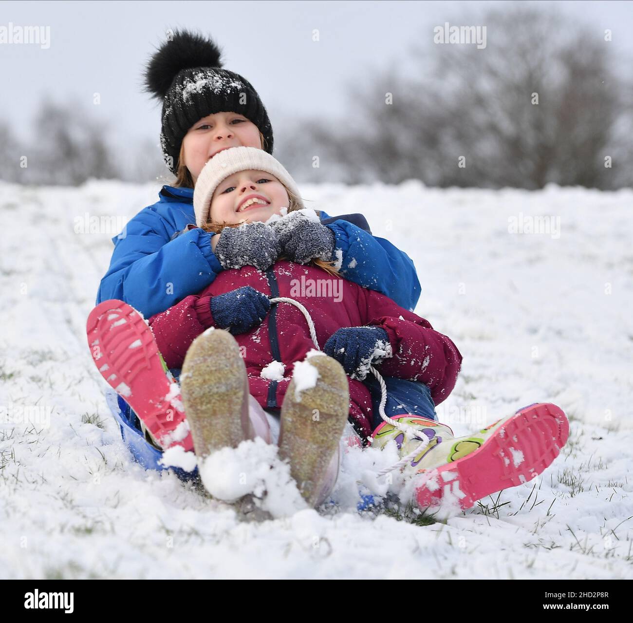 Pictured: Sisters Kerry Anne (7) and Jessica McBeth (9) from Armadale have some fun in the snow.  The first falls of snow in central Scotland meant fun in the snow for kids in Armadale, West Lothian.  (c) Dave Johnston Stock Photo