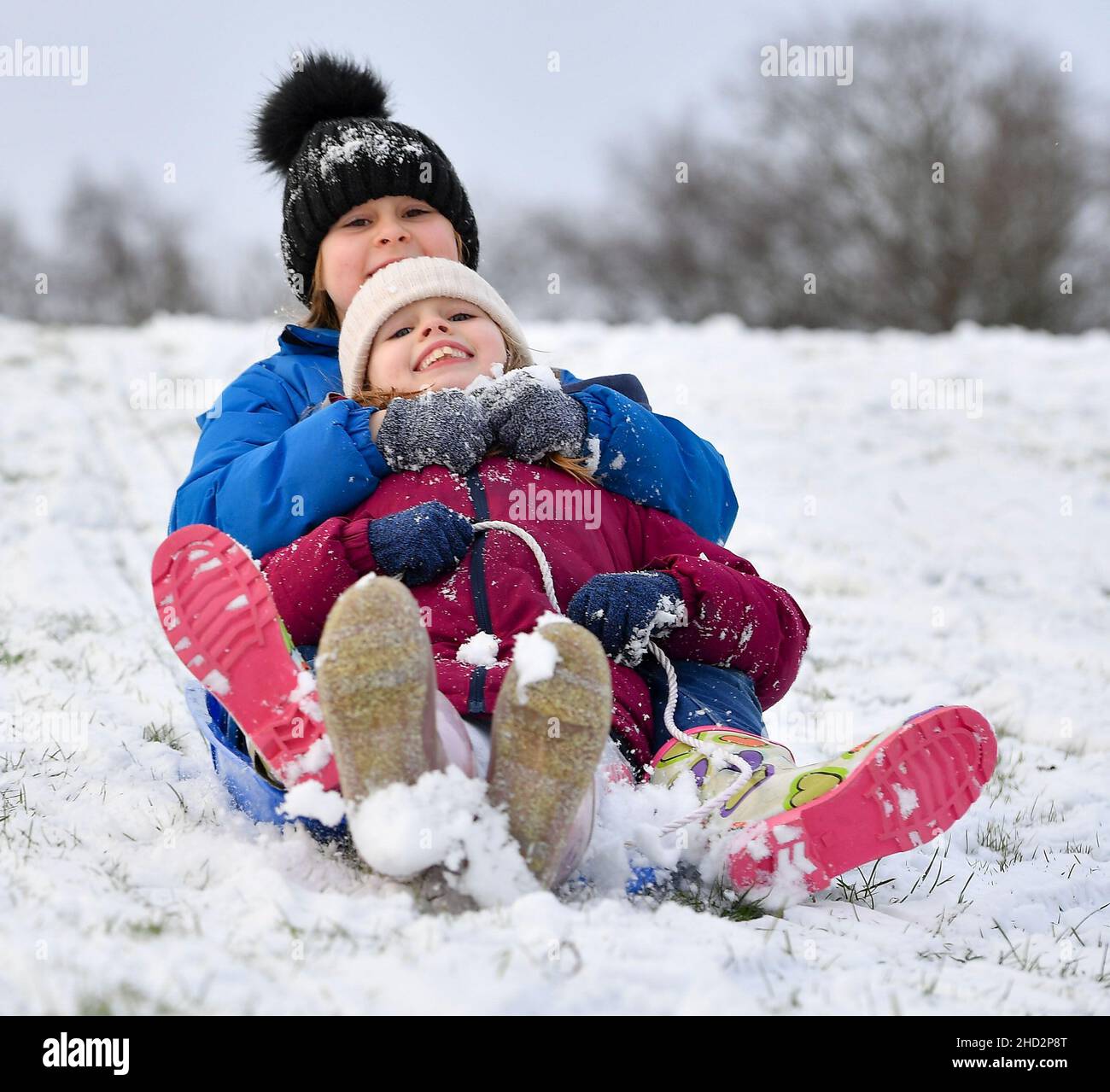 Pictured: Sisters Kerry Anne (7) and Jessica McBeth (9) from Armadale have some fun in the snow.  The first falls of snow in central Scotland meant fun in the snow for kids in Armadale, West Lothian.  (c) Dave Johnston Stock Photo