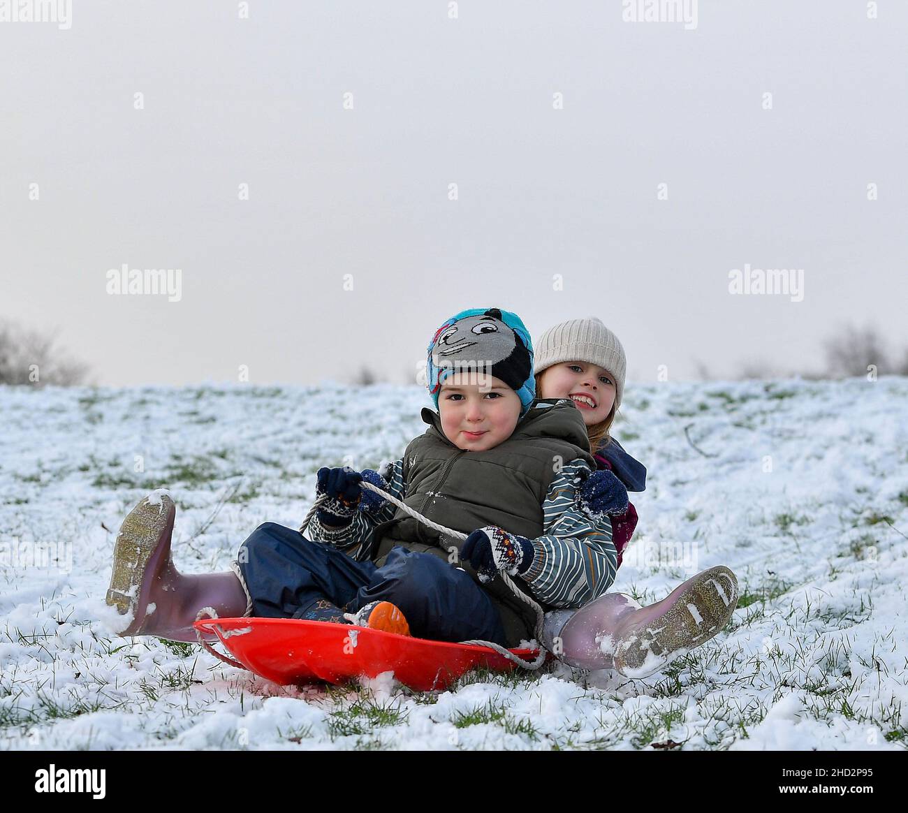 Pictured: Kerry Anne McBeth(7) and Pedro Alexiou-Carrico (4) from Armadale have some fun in the snow.  The first falls of snow in central Scotland meant fun in the snow for kids in Armadale, West Lothian.  (c) Dave Johnston Stock Photo
