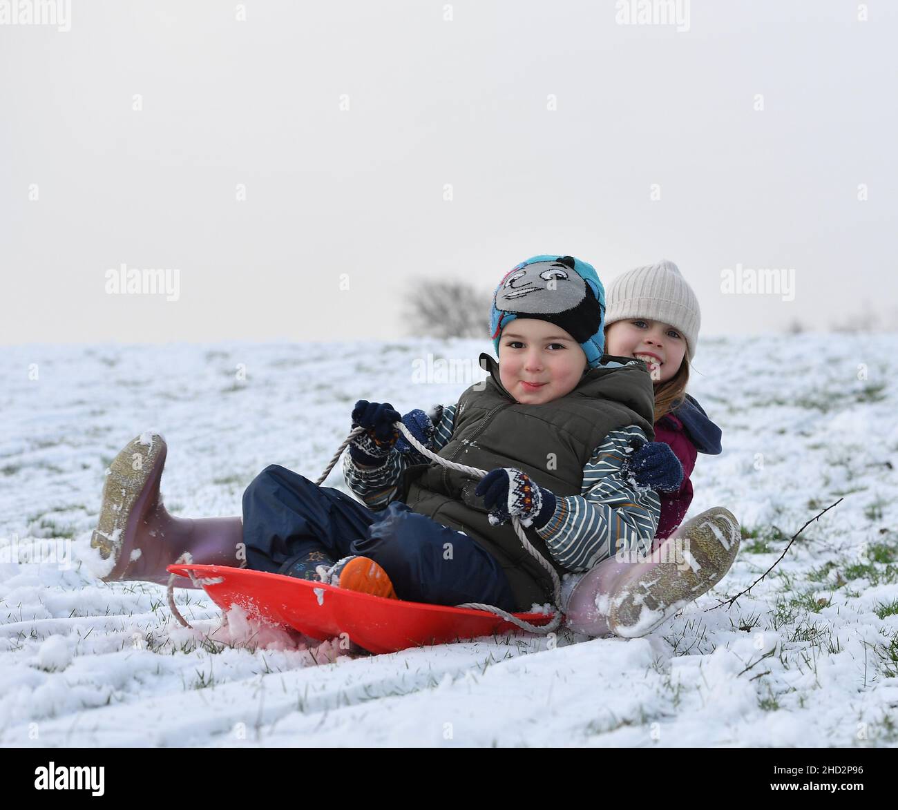 Pictured: Kerry Anne McBeth(7) and Pedro Alexiou-Carrico (4) from Armadale have some fun in the snow.  The first falls of snow in central Scotland meant fun in the snow for kids in Armadale, West Lothian.  (c) Dave Johnston Stock Photo