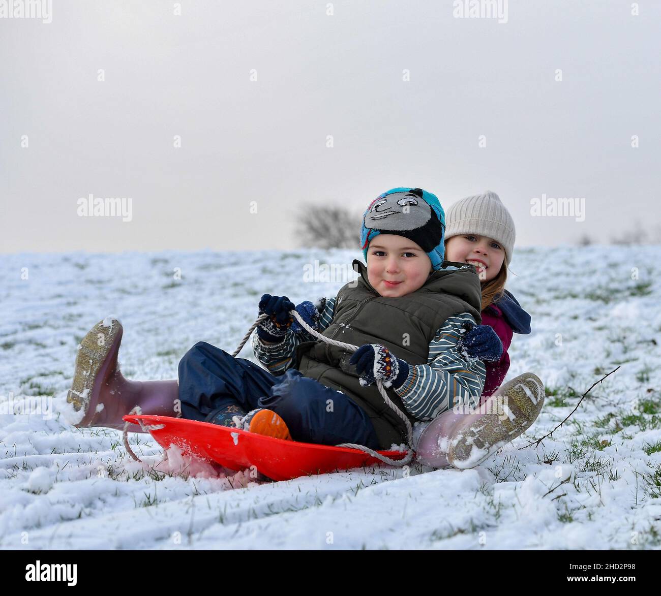 Pictured: Kerry Anne McBeth(7) and Pedro Alexiou-Carrico (4) from Armadale have some fun in the snow.  The first falls of snow in central Scotland meant fun in the snow for kids in Armadale, West Lothian.  (c) Dave Johnston Stock Photo