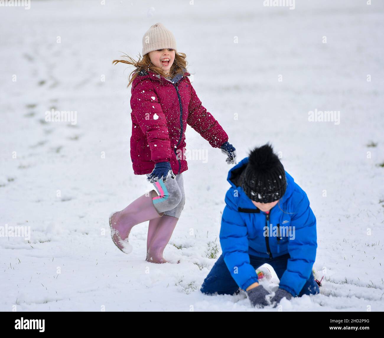 Pictured: Sisters Kerry Anne (7) and Jessica McBeth (9) from Armadale have some fun in the snow.  The first falls of snow in central Scotland meant fun in the snow for kids in Armadale, West Lothian.  (c) Dave Johnston Stock Photo