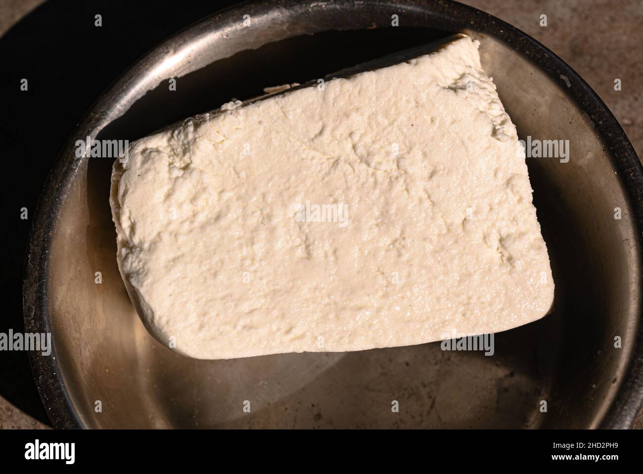 'Paneer', also known as 'ponir' or Indian cottage cheese, is a fresh acidset cheese common in