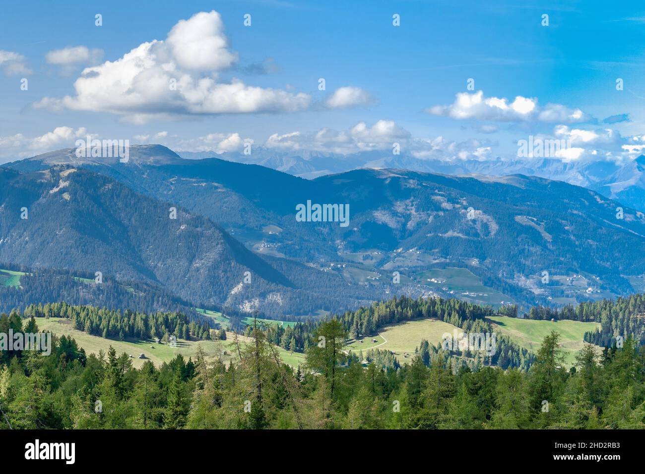 Overlooking the Puez-Geisler nature park mountains in the Dolomites seen from the Armentara meadows Stock Photo