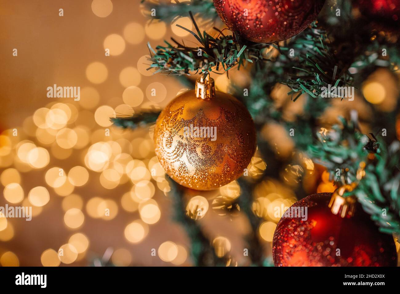 Christmas 2022 Themes Happy New Year 2022 Theme With Xmas Red And Gold Balls Decoration On Christmas Tree Branch Over Beautiful Lights Background. Selective Focus Stock Photo - Alamy