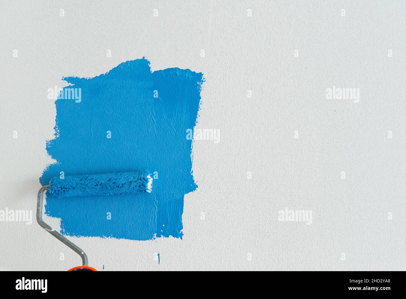Someone painting wall Stock Photo