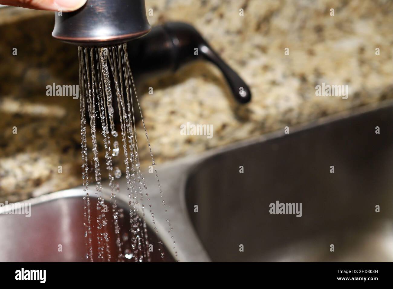 Splashing water coming out of a tap hires stock photography and images