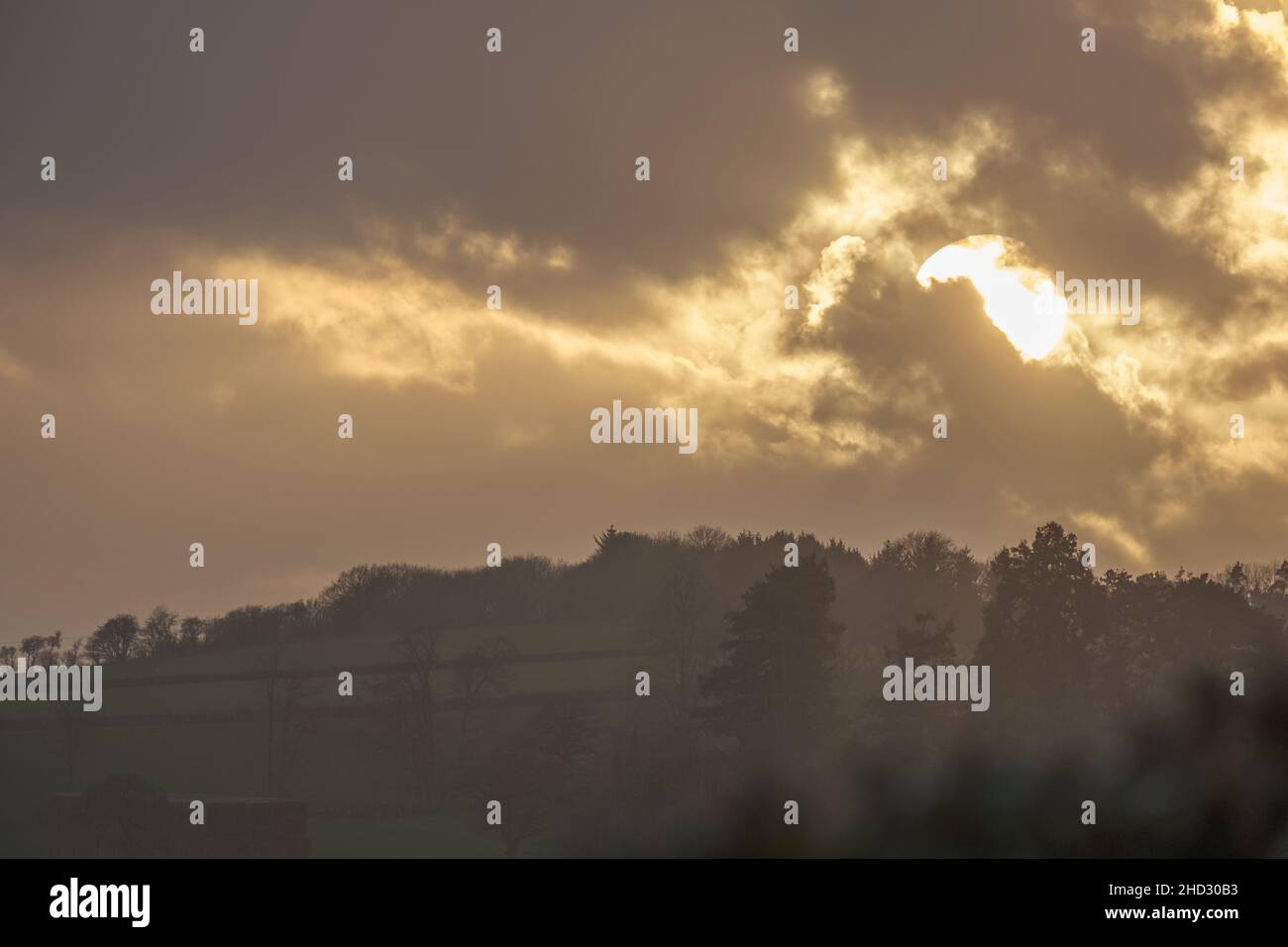 Dramatic sunset clouds over scenic countryside fields of Shropshire in UK Stock Photo
