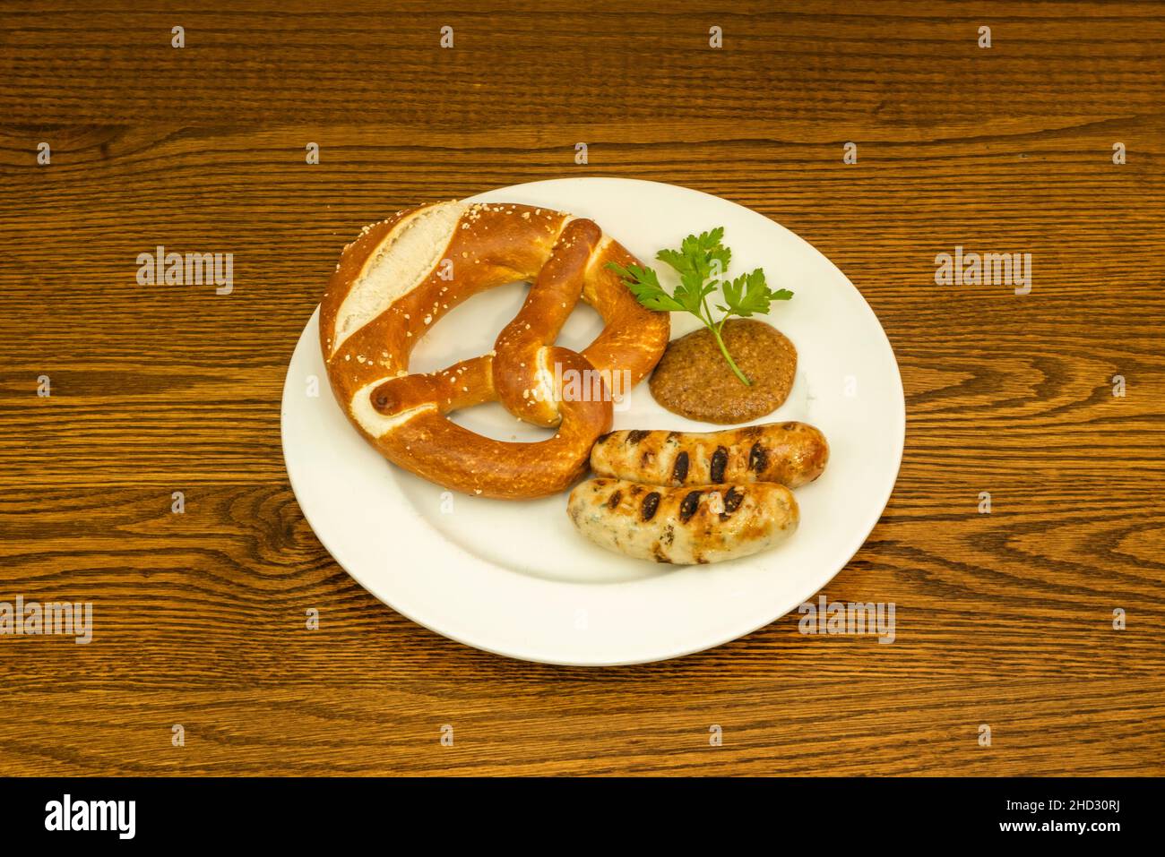 White sausage, or Muenchner Weißwurst in German, is one of the gastronomic specialties of Bavaria, in most German restaurants they serve the sausage a Stock Photo