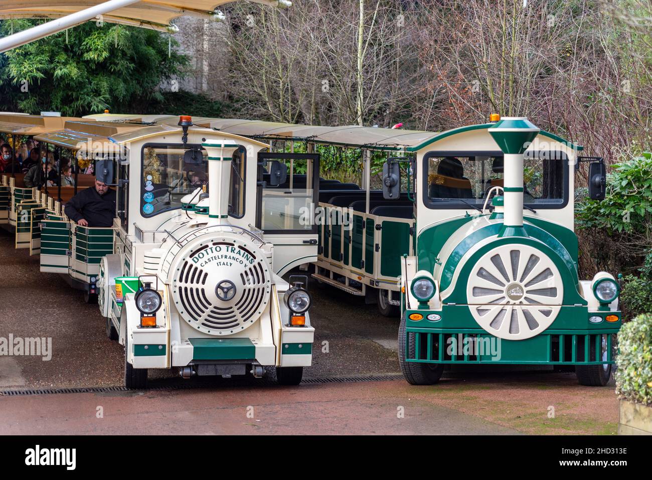 Lost Madagascar Express trains in 'station' at Colchester Zoo, Essex, UK. Transport experience for zoo visiting public. Built by Dotto Trains, Italy Stock Photo