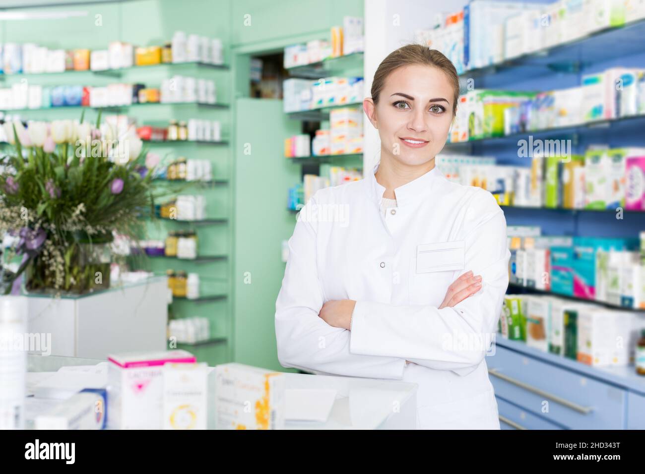 Young woman pharmacist standing hi-res stock photography and images - Alamy