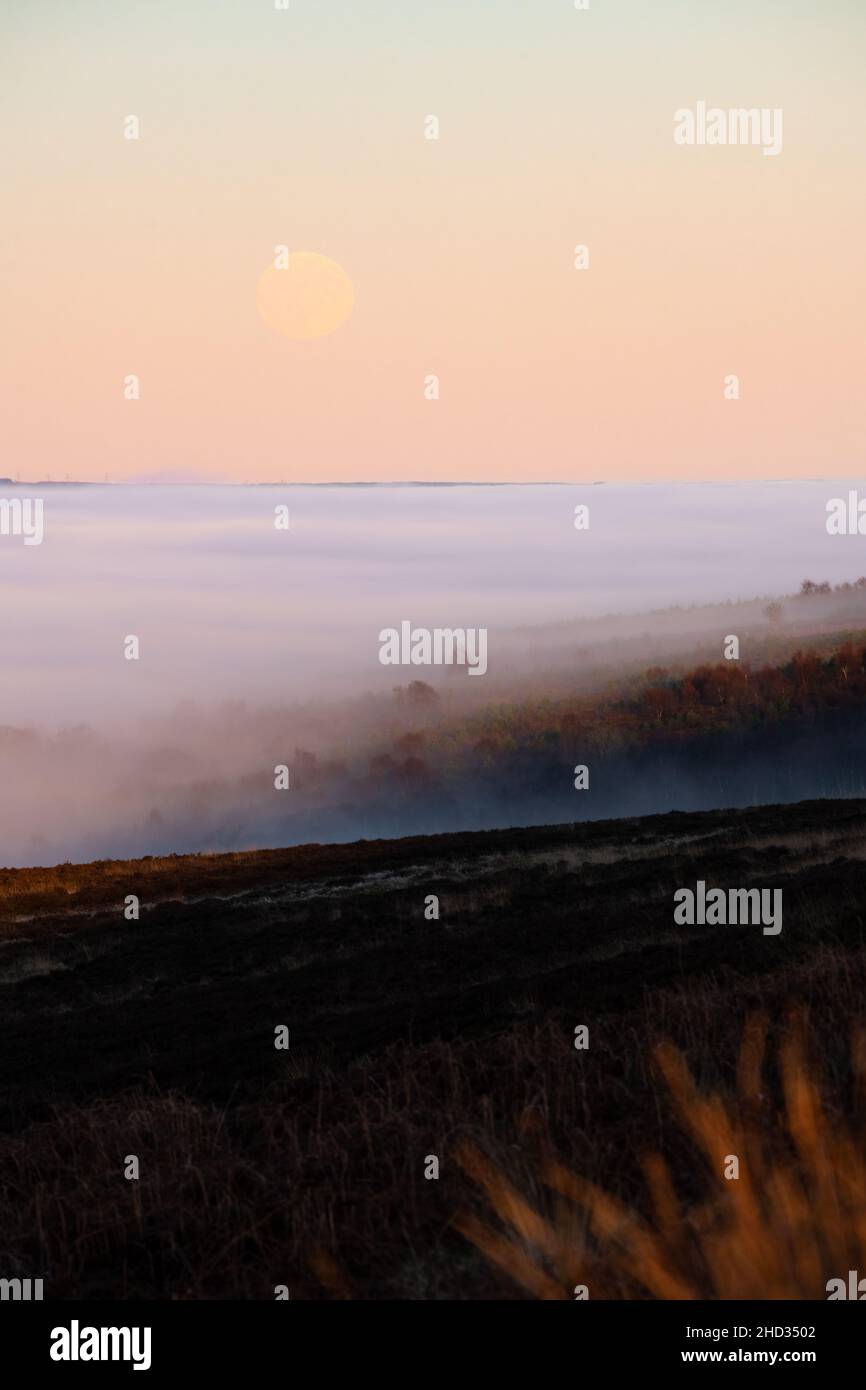 Cloud inversion in the Campsie Fells as the moon rises - Scotland, UK Stock Photo