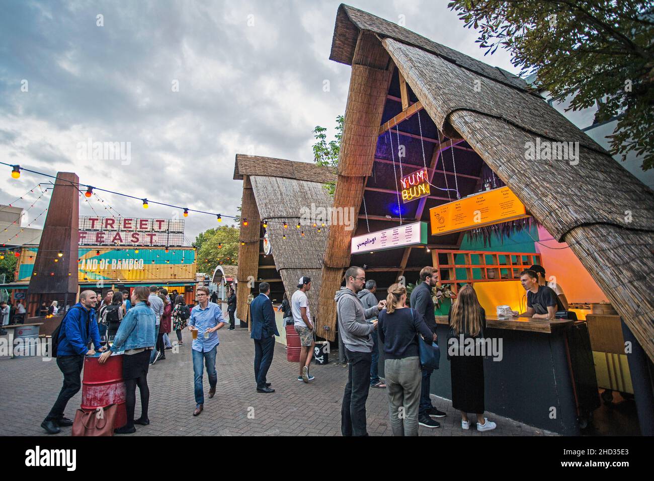 Great Britain / England /London , Peopel drinking and eating outside Hawker House street food market in East London . Stock Photo