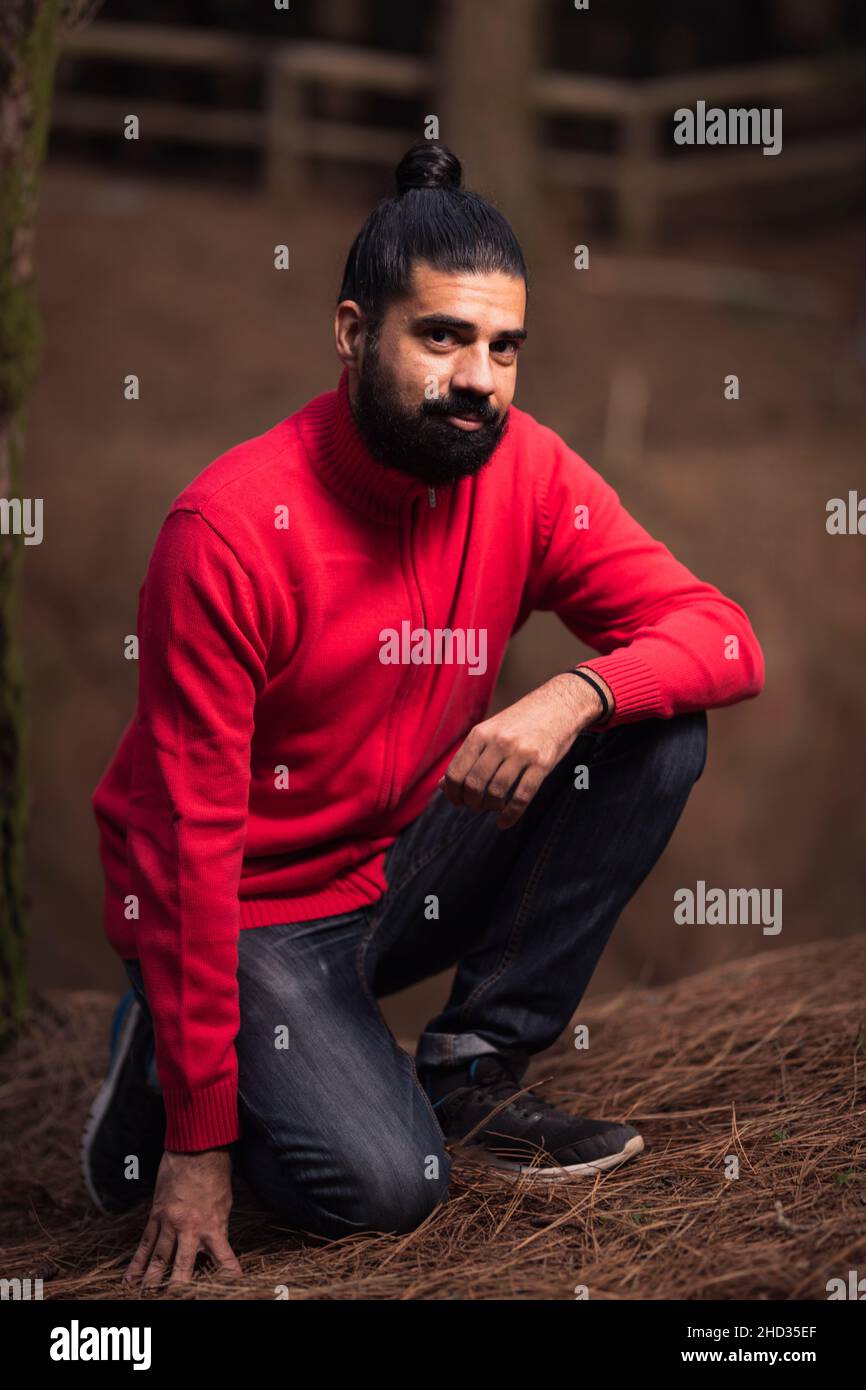 Kneeling man wearing hi-res stock photography and images - Alamy