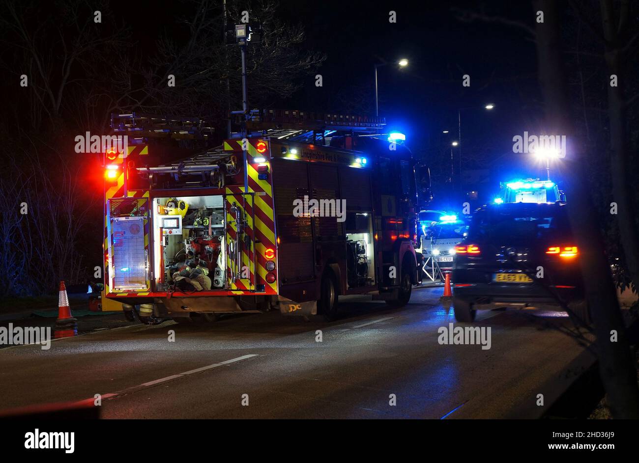 accident scene on the Spalding road at night with flashing lights from emergency vehicles Stock Photo