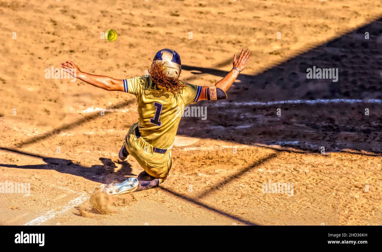 A Baseball Player Is Sliding Into Home Plate To Beat the Throw Home And Score A Run In Illustration Image Style Stock Photo