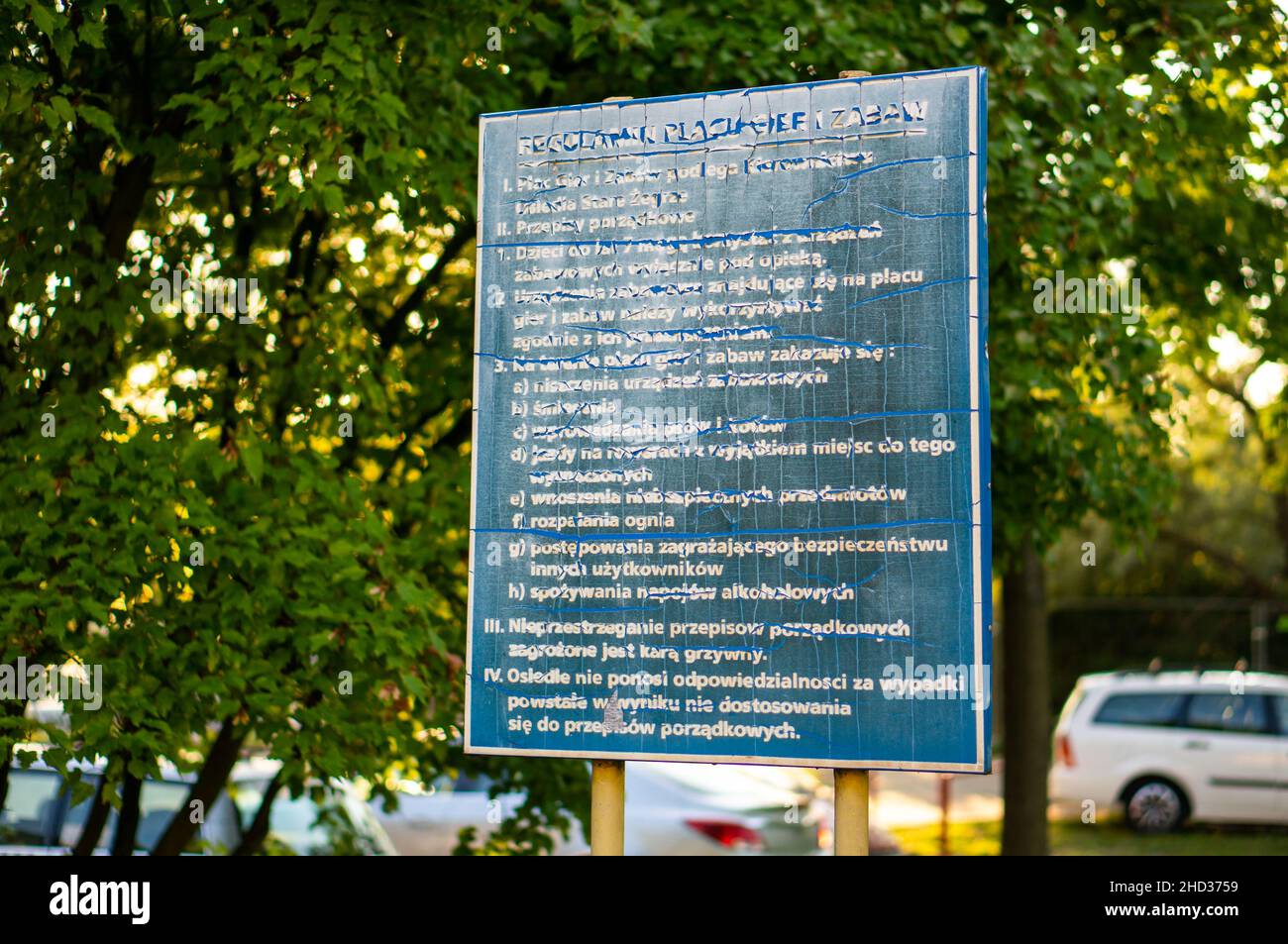 Board containing rules and information by a playground in Poland Stock Photo